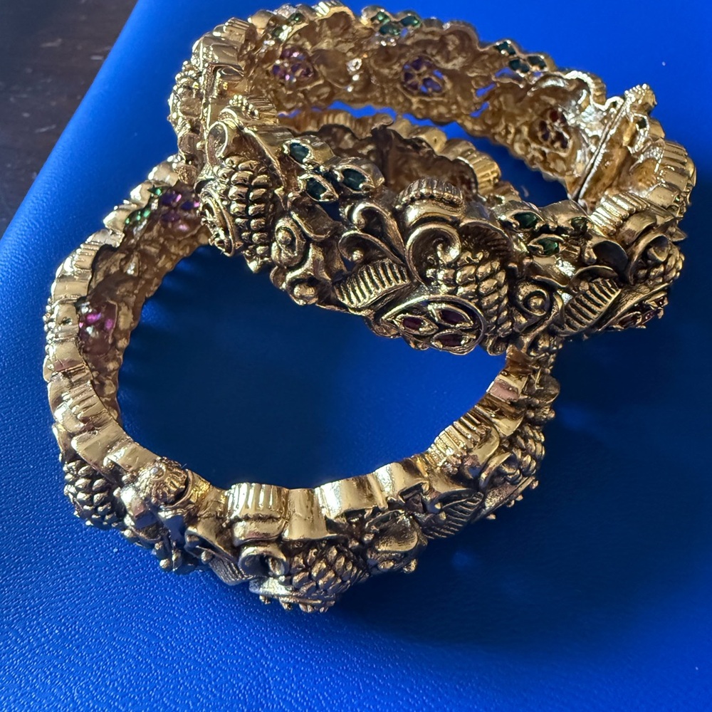 Elegant Gold-Tone Bangles with Intricate Design. Antique design